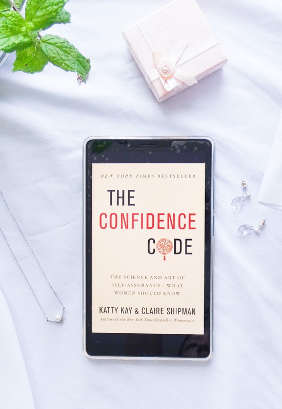 The Confidence Code book displayed in a clean, elegant layout